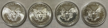 American Silver Eagles 1986, 1987, 1988, 1990 $1 AMERICAN SILVER EAGLES 1 OZ, 4 COIN LOT GEM BU IN CASE