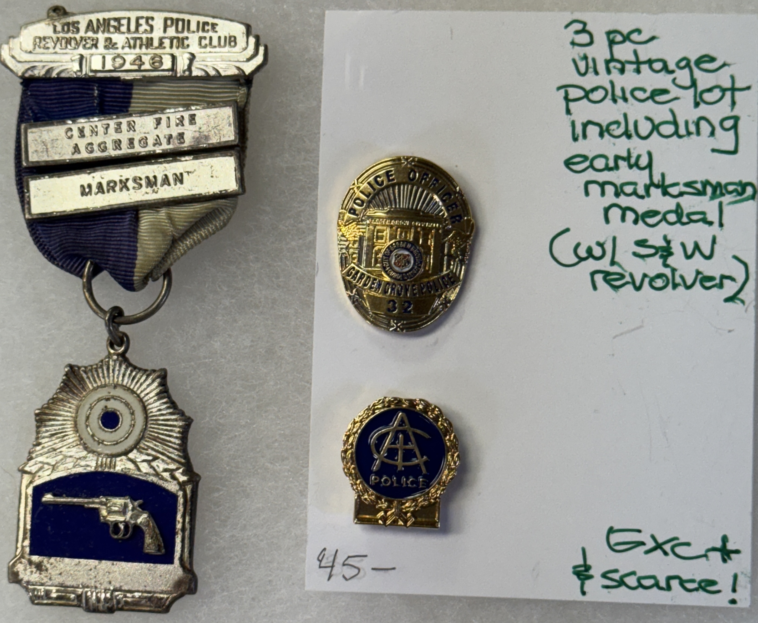 Miscellaneous LOT OF 3 VINTAGE POLICE BUTTONS/PINS INCLUDING 1946 LA POLICE S&W MARKSMAN MEDAL Miscellaneous LOT OF 3 VINTAGE POLICE BUTTONS/PINS INCLUDING 1946 LA POLICE S&W MARKSMAN MEDAL
