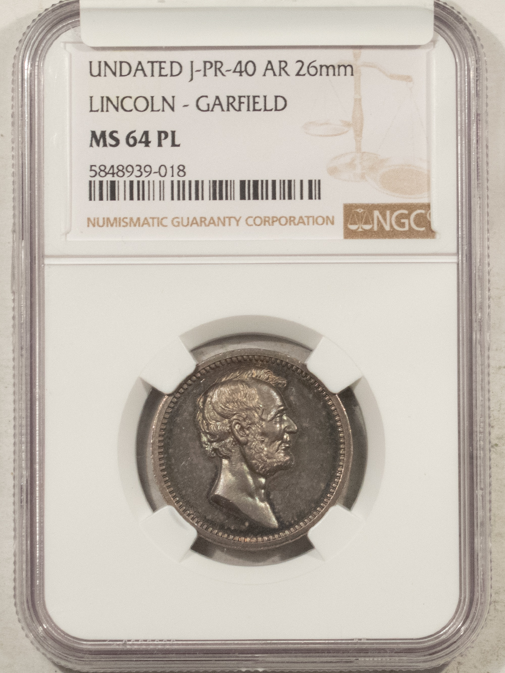 Exonumia UNDATED J-PR-40 AR 26MM LINCOLN-GARFIELD MEDAL – NGC MS-64 PL Exonumia UNDATED J-PR-40 AR 26MM LINCOLN-GARFIELD MEDAL – NGC MS-64 PL