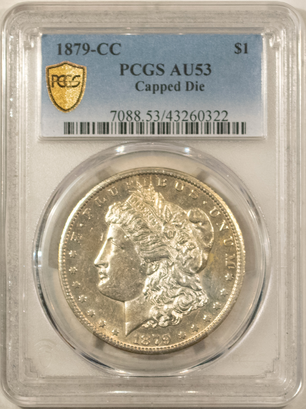 Dollars 1879-CC $1 MORGAN DOLLAR, CAPPED DIE, PCGS AU-53, WHITE & SEMI PL-NICE EXAMPLE! Dollars 1879-CC $1 MORGAN DOLLAR, CAPPED DIE, PCGS AU-53, WHITE & SEMI PL-NICE EXAMPLE!