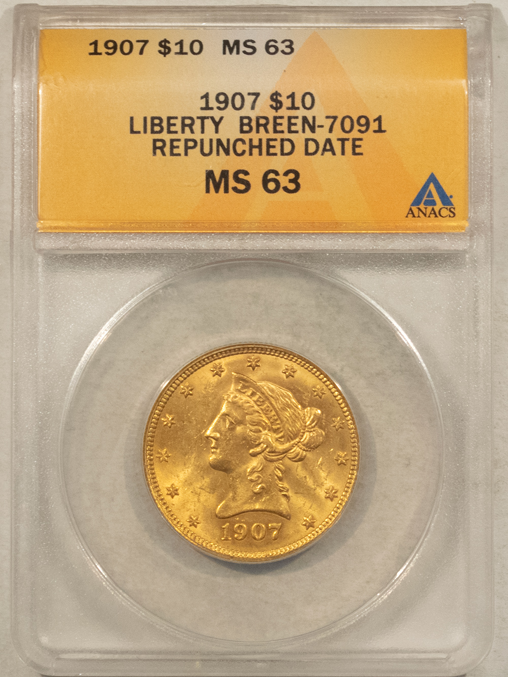 $10 1907 $10 LIBERTY GOLD EAGLE, BREEN-7091 REPUNCHED DATE – ANACS MS-63 FLASHY $10 1907 $10 LIBERTY GOLD EAGLE, BREEN-7091 REPUNCHED DATE – ANACS MS-63 FLASHY