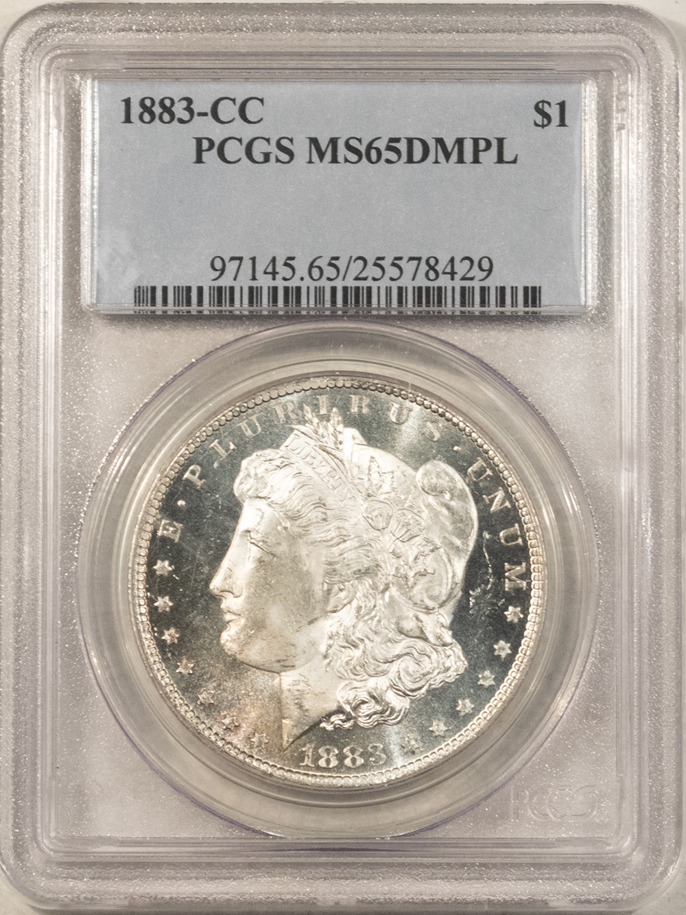 Dollars 1883-CC $1 MORGAN DOLLAR – PCGS MS-65 DMPL FRESH, FROSTY DEEP MIRROR PROOFLIKE Dollars 1883-CC $1 MORGAN DOLLAR – PCGS MS-65 DMPL FRESH, FROSTY DEEP MIRROR PROOFLIKE